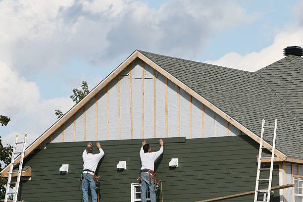 Professional Storm Damage Siding Repair technician working in Vandalia, OH